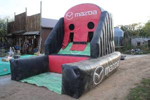 lot 1937 image: 12 Mazda Football theme Inflatable Game