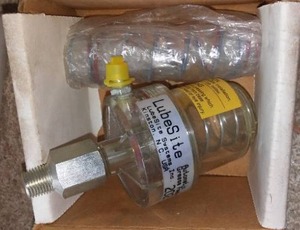 lot 213 image: LubeSite Automatic Grease Feeder.