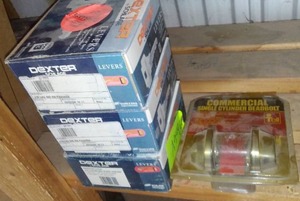lot 258 image: Dexter by SCHLAGE Levers (3 boxes), Commercial Deadbolt (1).