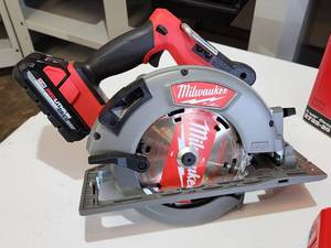 lot 8 image: Milwaukee M18 Fuel Cordless Circular Saw with Battery and Charging Station
