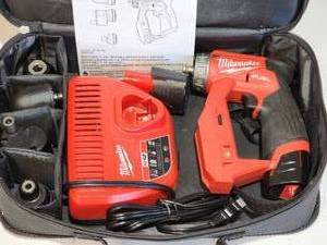 lot 76 image: Milwaukee M12 Cordless Drill Driver with Battery and Charging Station