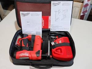 lot 78 image: Milwaukee M12 Cordless 23 Gauge Pin Nailer with Battery and Charging Station