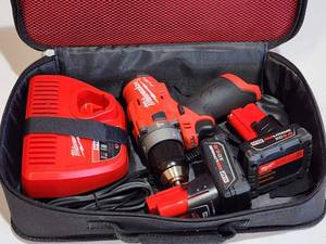lot 80 image: Milwaukee M12 Cordless 12 Drill  Driver with Battery and Charging Station