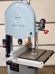 lot 6 image: Delta Band Saw Model 28-20M on a Rolling Base