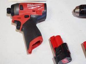 lot 55 image: Milwaukee M12 Cordless Combo Hammer Drill & Impact Driver with (2) Batteries and Charging Station
