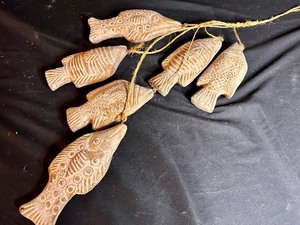 lot 118 image: Stringer of 6 Terracotta Fish