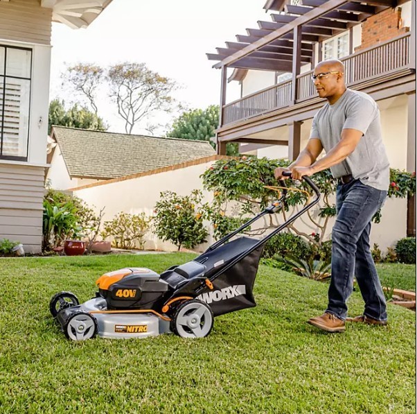 lot 150 image: NEW Worx 20 Push Mower, 13 String Trimmer, Quiet Tech Blower Combo Kit