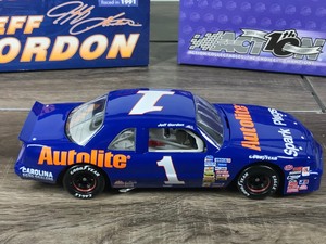 lot 126 image: 2002 Nascar Action Racing Collectible 1989 Thunderbird Jeff Gordon #1  Autolite 124 scale die cast stock car