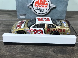 lot 145 image: 1999 Nascar Mac Tools Collectors Club Jimmy Spencer Ford Taurus #23  Gold Winston 124 scale die cast stock car
