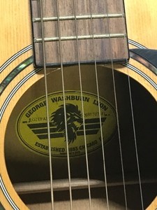 lot 182 image: George Washburn Lyon Guitar with Case and 4 Packages of Guitar Strings
