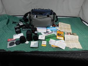 lot 11 image: 2 Vintage cameras ( Brownie Starlet) and (1983 Canon AE-1 with many extras)