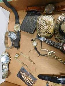 lot 12 image: Watches. belt buckles, knives