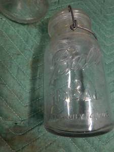 lot 17 image: 2 vintage glass top ball jars and another glass top jar