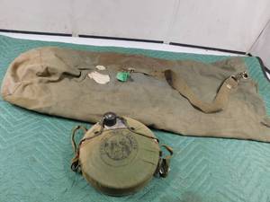 lot 29 image: Army duffle bag and official Trail canteen