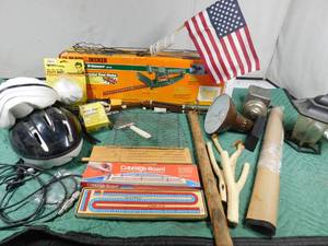 lot 42 image: Electric hedge trimmer, adjustable lamp, billy club, 3 sling shots, cribbage boards and more