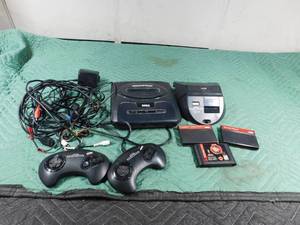 lot 53 image: Sega with sega Geneses power base converter and 3 games and cords