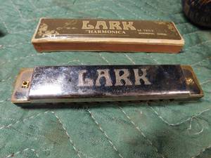 lot 306 image: 3 Morroccos and a harmonica