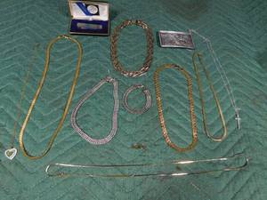 lot 307 image: Bag of jewelry. knife and belt buckle