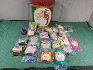lot 100 image: Norman Rockwell 400th Anniversary popcorn tin full of McDonald happy meal toys in pkg