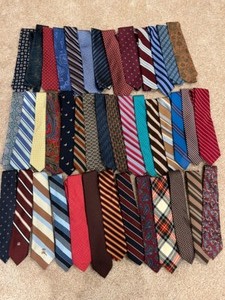 lot 271 image: Large Group of Mens Neckties Justers, Claiborne, Nautica, Brooks Brothers, Tom James, J. Garcia, etc.