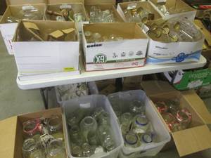 (RMC) 12 Boxes and Totes Full of Assorted Glass Decor Glasses Jars Candle Sticks Vases Etc
