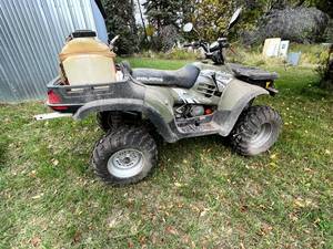 lot 6 image: 2004 Polaris ATP 330 4x4 with Sprayer