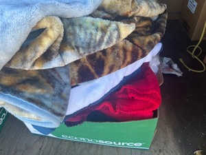 box of towels and blankets