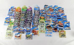 lot 16 image: 70 Hot Wheels Including 2007 Easter Egg-Clusive, Clover Cars, Green Lantern and More