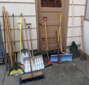 lot 18 image: Assortment of Lawn Tools Post Hole Digger, Rake, Shovels, Broom, Pickaxe, Greensweeper, Etc.