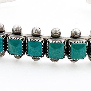 lot 21 image: Zuni Square Petit Point, Sterling Silver Cuff Bracelet, Set With Deep Green Turquoise.