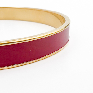 lot 33 image: Monet Yellow Plated Base Metal Slip-On Bangle Bracelet. Red Enamel