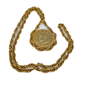 lot 44 image: Eisenhower dollar (plated) coin pendant, Unknown Maker, Base Metal Opera Necklace.