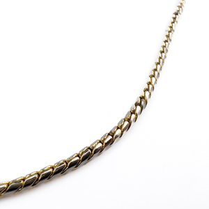 lot 72 image: Sleek, Unknown Maker, Round Snake Yellow Base Metal Chain Necklace.