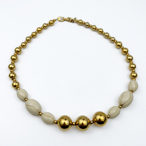 lot 134 image: Napier Carved Cream Color Yellow Plated Base Metal Bead Necklace.