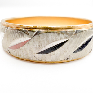lot 2 image: Paramount  Patterned Wedding Band Yellow And White 14K Ring. Size 10 - 10.25.