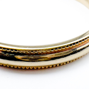 lot 6 image: Stuller Milgrain Edge Yellow 10K Ring. Size 9.5 - 9.75.