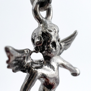 lot 103 image: Cupid angel, Unknown Maker, Sterling Silver Solid Cast Charm.