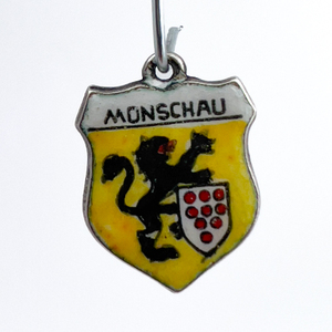 lot 120 image: Munschau Travel Shield, Unknown Maker, 800 Silver Enamel Charm.