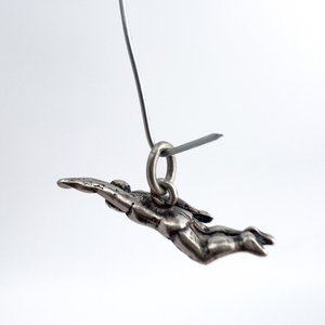 lot 131 image: Female Swimmer , Unknown Maker, VINTAGE Sterling Silver Solid Cast Charm.