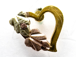 lot 7 image: Coleman (Black Hills Gold) Heart With Leaves Yellow, White & Rose 10K stud Earrings .