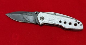 lot 23 image: Cabelas Pocket Knife