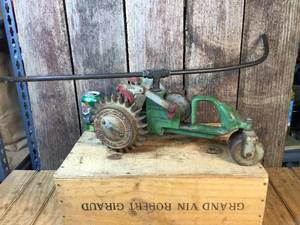 lot 154 image: Vintage Walker Cast Iron Tractor Sprinkler