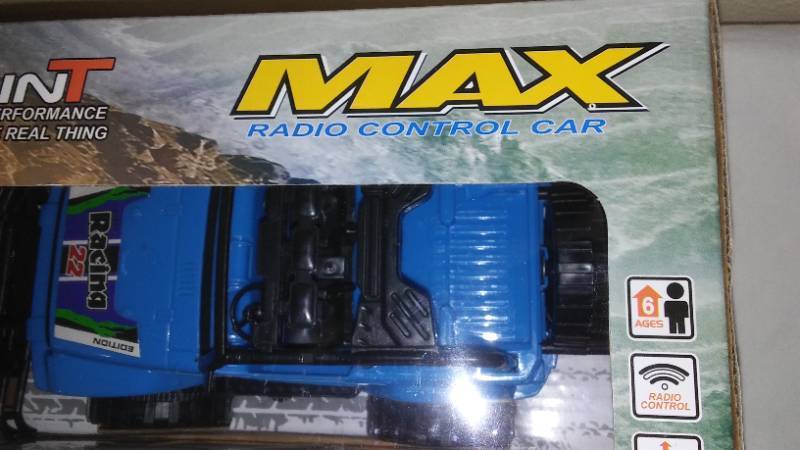 lot 707 image: Battery Operated Cross-Country Car with Steering Wheel Remote Control