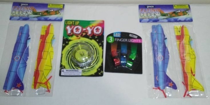 lot 719 image: Light Up Yo-yo, Flying Gliders (2) and LED Finger Lights.