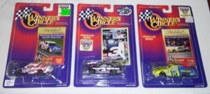 lot 616 image: John Force Funny Car Drag Racers (3)