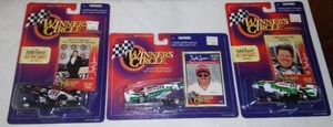 lot 617 image: John Force Funny Car Drag Racers (3)