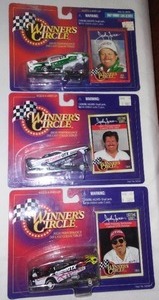 lot 639 image: John Force Funny Car Dragsters (3) Winners Circle.