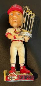 lot 48 image: St. Louis Cardinals Bobblehead Lot of 4 and Commemorative 1982 World Series Glass - Pujols in box, Vina in box, Carpenter no box, Cardinal Mascot in box, baseball memorabilia