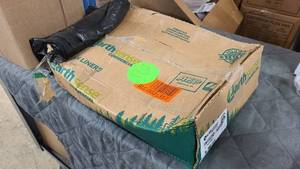 Squished box of Earth Sense Commercial 55-60 Gallon Can Liners