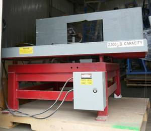 lot 16 image: 2,000 lb 90 Degree Tilt table (with cutout in the ledge)